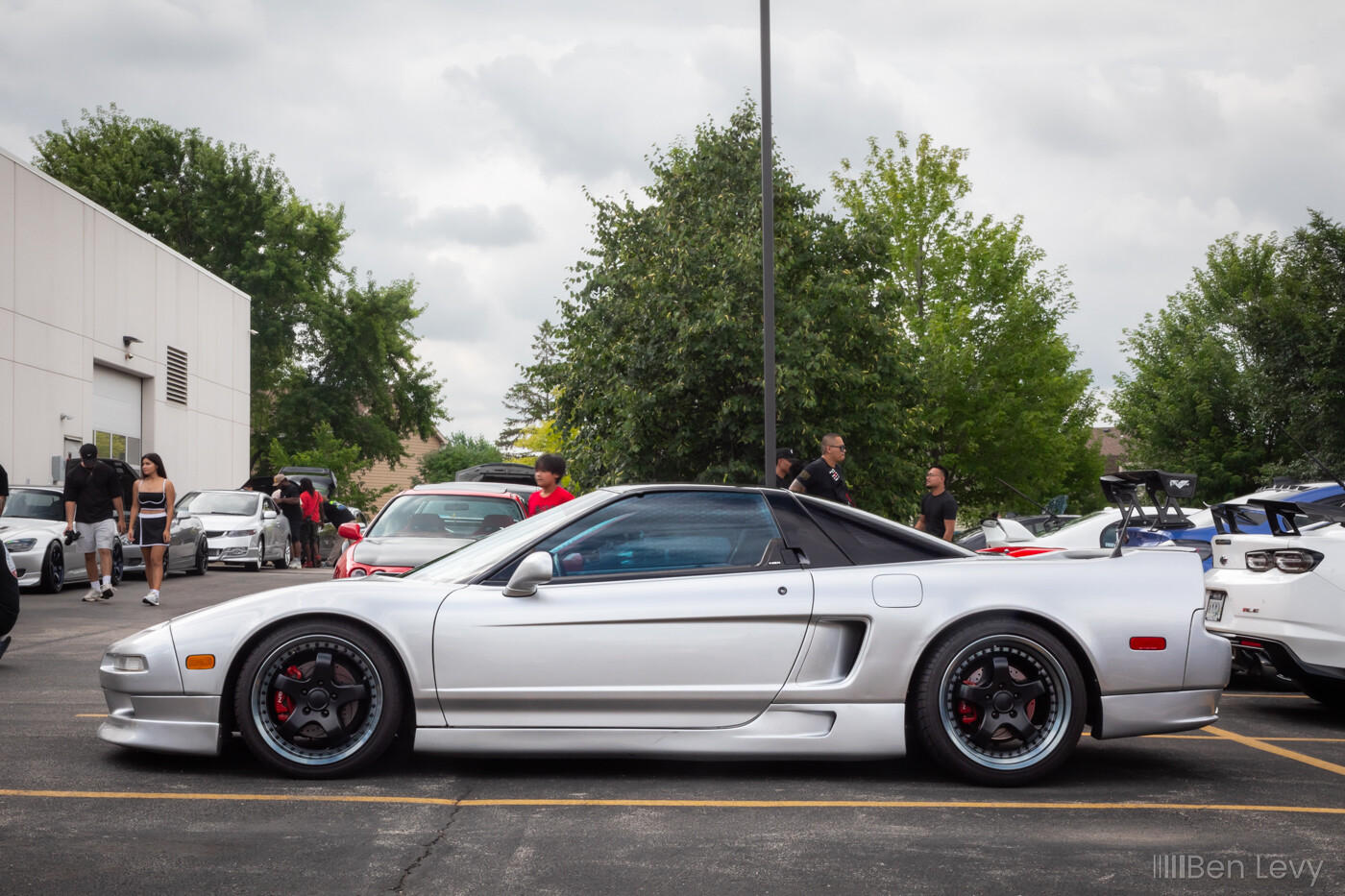 Side of a Silver Acura NSX on Black Five Spoke Wheels
